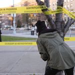 An artist and activist wrapped several trees with crime scene-style tape warning passersby of the dangers of gentrification.<br/>
